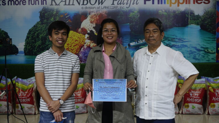 New graduate Jelyn Salamanca with recruiter BM Dennis Salamanca, receives her certificate from SD Santi Dapul