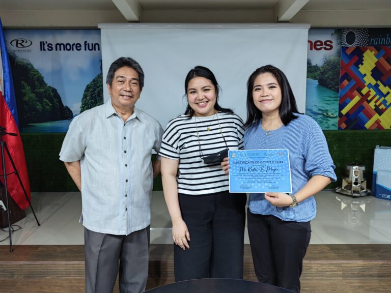 SD Santi Dapul congratulating October graduate, Ms. Kristel Muyco as Senior Dealer after completing her Dealer Partnering Program with recruiter MD Reyna Bataller