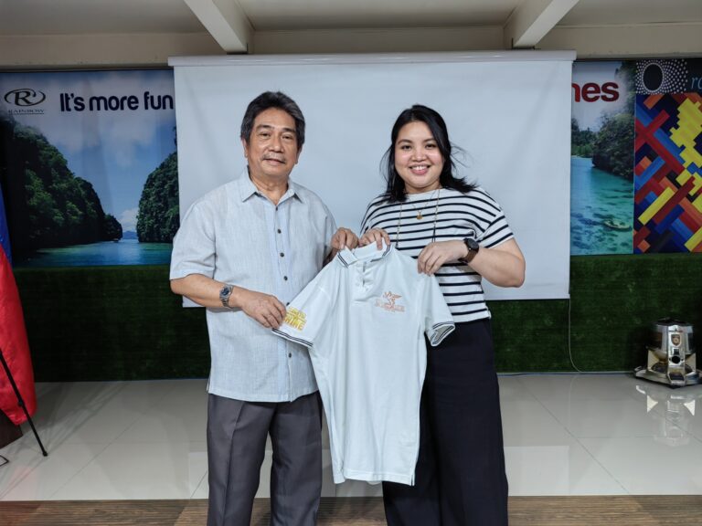 MD Reyna Bataller proudly showing her white polo shirt with the Rexair vintage logo as her prize for doing 3 demos in the last Time to Shine program