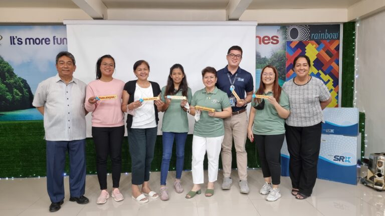 December Birthday celebrants  (L –R)  RD Jelyn Salamanca, RD Nora Inocencio, Marketing Assistant Morena Abillion, MD Marison Neria, AD John Tolentino and Treasurery Officer Jingky Isidoro  receive  Toblerone as a token from SD Santi Dapul and Treasurer Rose Dapul.