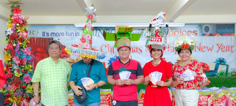 The top four contestants from the Headdress Competition using recyclable materials are 1st Place – Service Technician Willy Dancel, 2nd – Product Specialist Jonh Levie Francisco; 3rd – AD Josie Bataller and 4th – Godsown Marketing Staff Nora Inocencio receive their cash prizes from SD Santi Dapul.