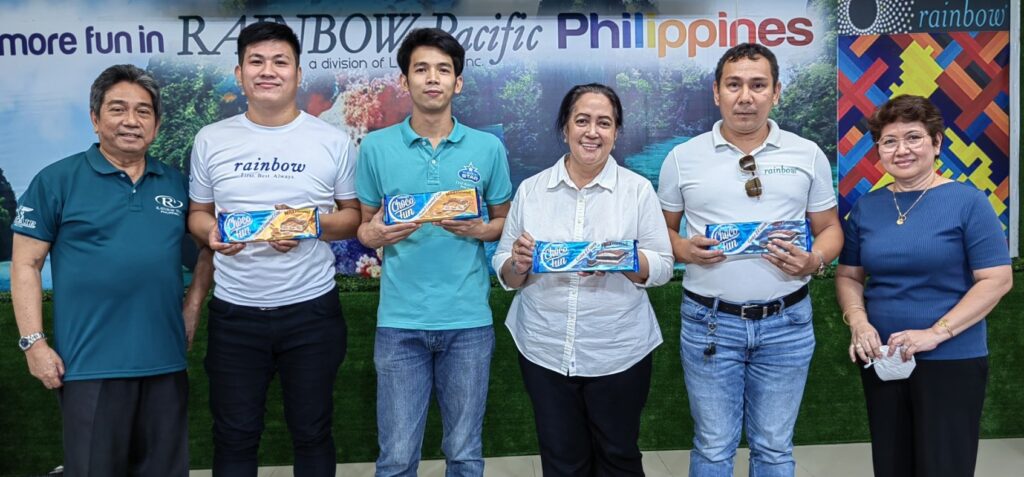 April Birthday celebrants including Finance Director Rose Dapul (3rd from R) receive their traditional chocolate bars from SD Santi Dapul (L) and MD Marison Neria.