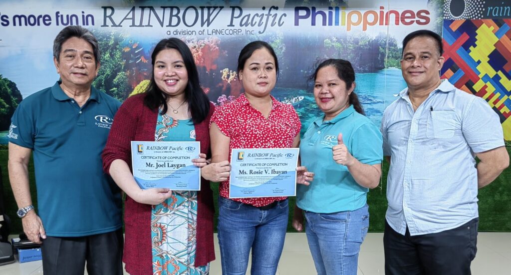 Graduates who are now qualified to join the Rainbow business as a Trainee Dealers receive their Diploma from SD Santi Dapul and Trainer GM Victor Tuplano.