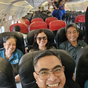 TL Noel Buenavista (F) captured a group photo while boarding the plane bound to Puerto Princesa with FD Rosanna Dapul (1st L), ED Grace Cruz (C), and SD Santi Dapul (1st R).